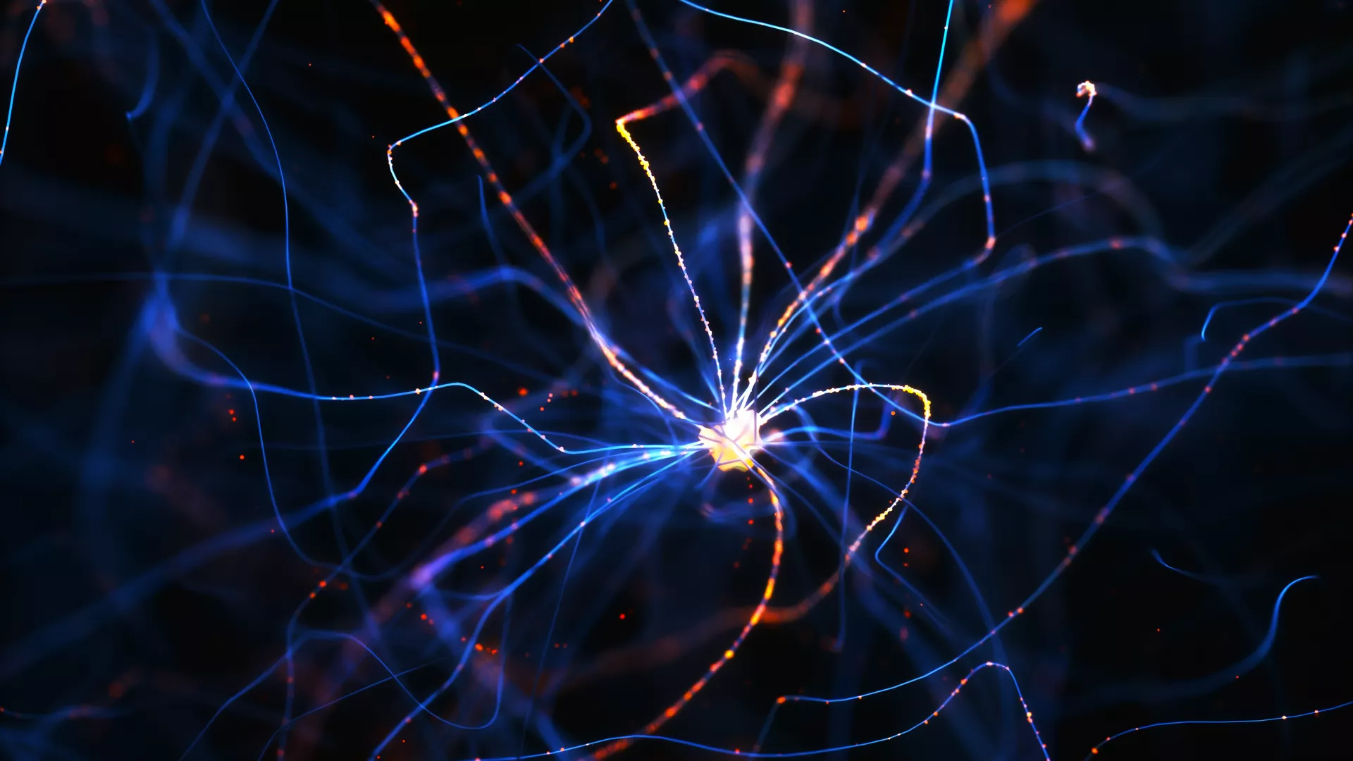 Abstract close-up of glowing blue lines radiating from a bright central core on a dark background, resembling a neuron or a burst of energy, with small orange nodes scattered along the filaments.